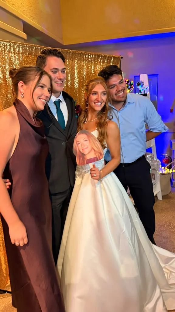 Bride with friends posing at a wedding reception