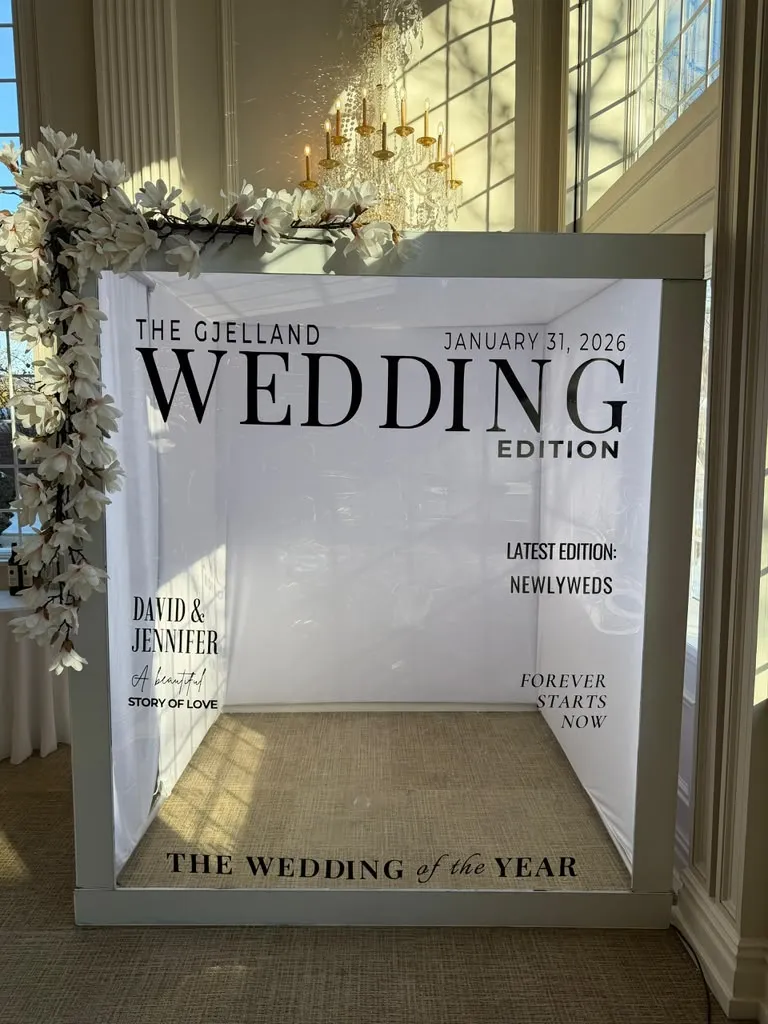 Light-up Magazine Box with a custom Wedding Edition cover and a flower arch